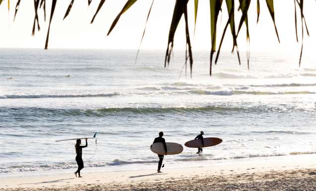 surfers on Kingscliff beach on The Tweed which made lonely planet's 2027 Top Experiences Hotlist