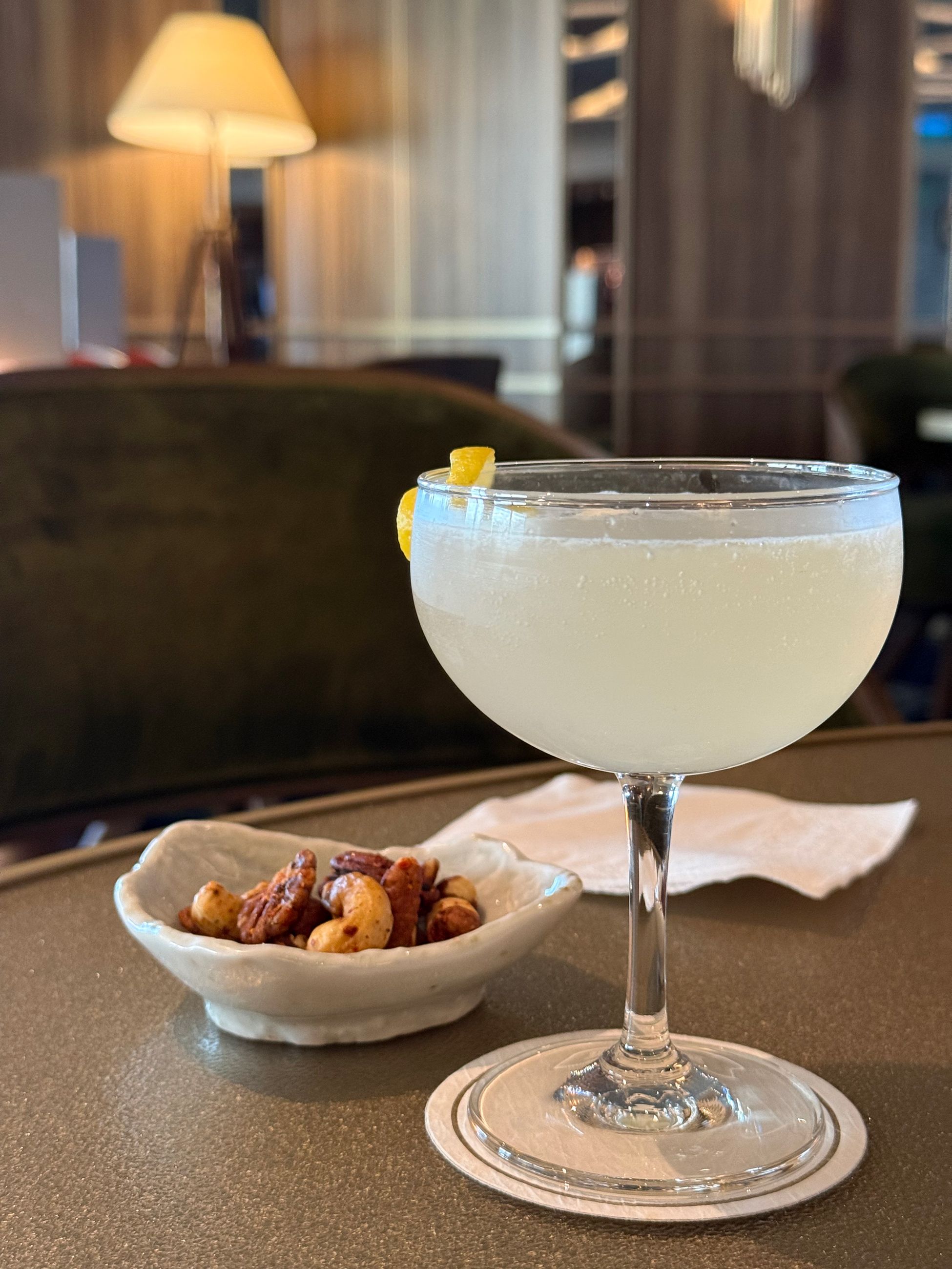 Gin cocktail and nuts at The Club on Seabourn Pursuit
