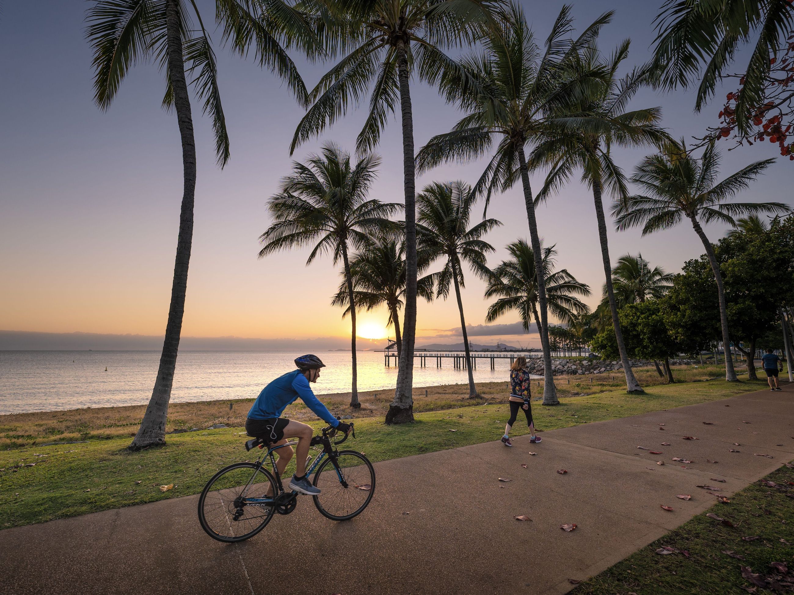 biking at sunset in The Strand, Townsville