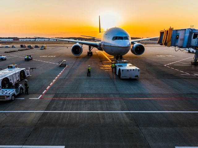 airplane at the airport during sunset