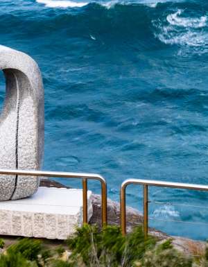 Keizo Ushio’s white looped stone sculpture Oushi Zokei - Enmusubi II beside the sea on the Bondi to Tamarama coastal walk
