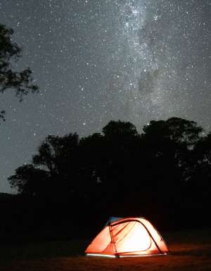 tent below a sky of stars