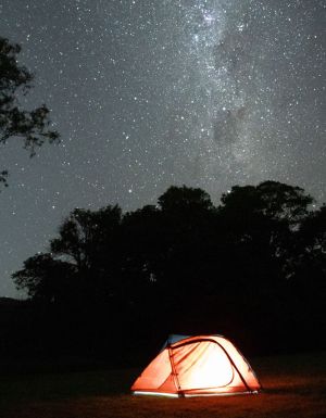 tent below a sky of stars
