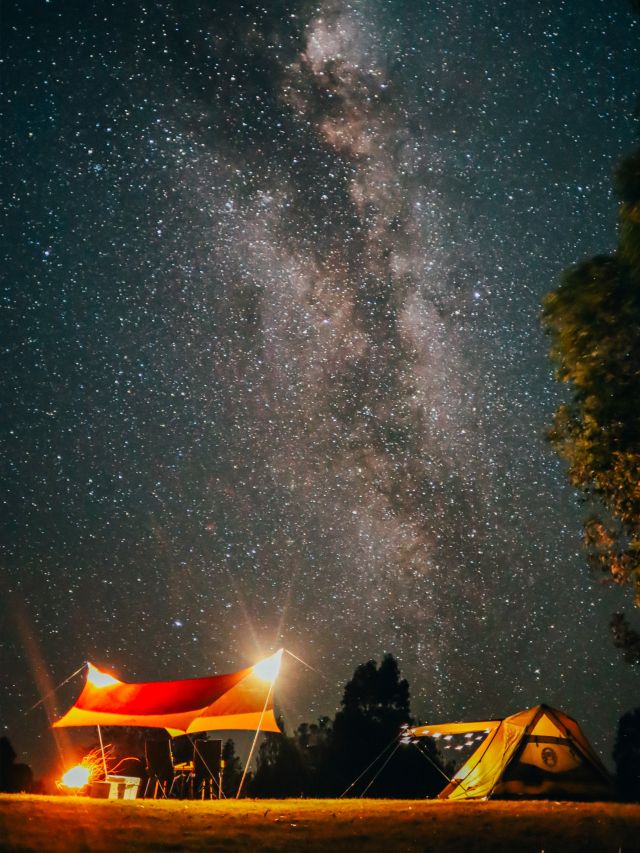 Tent under a night sky