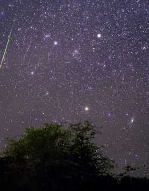 Bright meteor streaking across the night sky above Payson, Arizona during the Leonids meteor shower